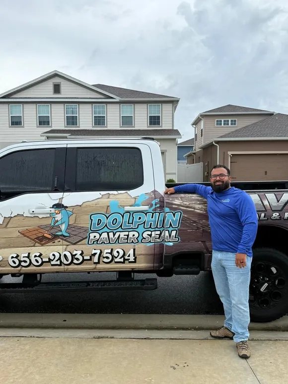 David with the Dolphin Paver Seal service truck